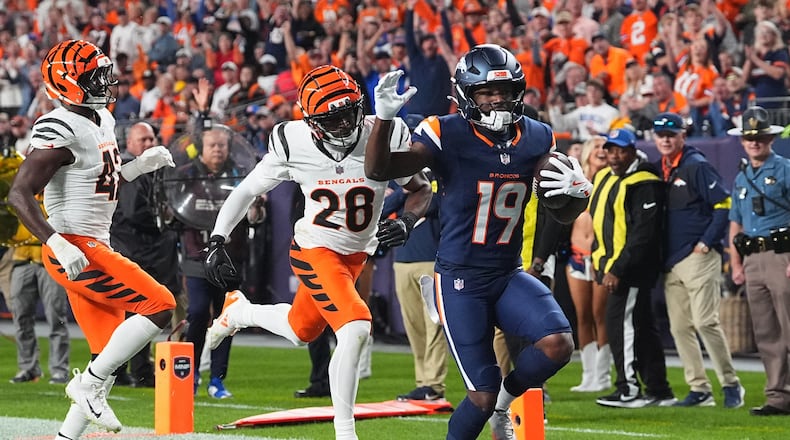 Denver Broncos wide receiver Marvin Mims Jr. (19) scores a touchdown against the Cincinnati Bengals during the first half of an NFL football game Monday, Sept. 29, 2025, in Denver. (AP Photo/David Zalubowski)