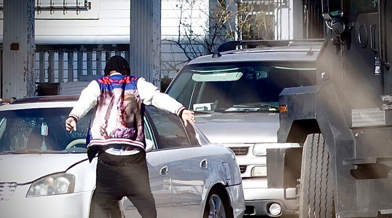 A man surrendered to police following a standoff on Wisconsin Boulevard in Dayton on Thursday, Jan. 2, 2025. MARSHALL GORBY/STAFF