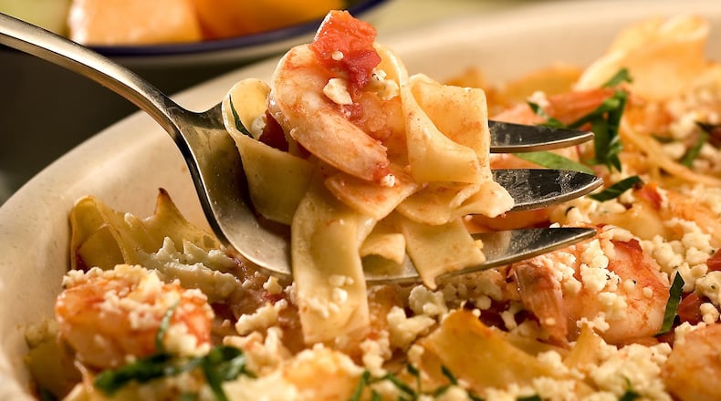 Shrimp, feta and tomatoes come together for a simple spaghetti dish that’s packed with flavor. (Bob Fila/Chicago Tribune/TNS)