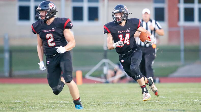 Tecumseh High School junior Tim Moore, Jr. (14) runs the ball during their game against Carroll on Friday, Aug. 26, 2022 at Spitzer Stadium in New Carlisle. The Arrows won 35-3. CONTRIBUTED PHOTO BY MICHAEL COOPER