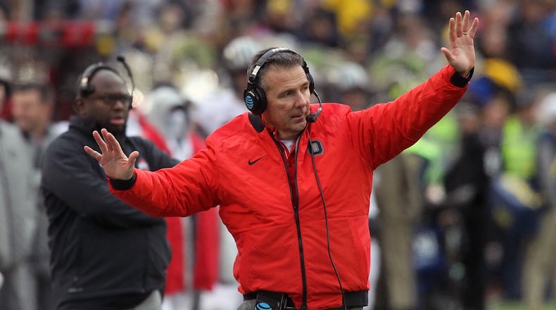 Ohio State’s Urban Meyer talks to his players during a game against Michigan on Saturday, Nov. 25, 2017, at Michigan Stadium in Ann Arbor, Mich. David Jablonski/Staff