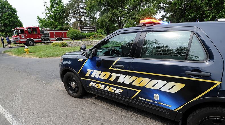 Trotwood police and fire departments blocked the entrance to Madison Lakes Park Monday, June 5, 2023, in Trotwood. A 17-year-old went missing in the lake Sunday, June 4, 2023. MARSHALL GORBY\STAFF