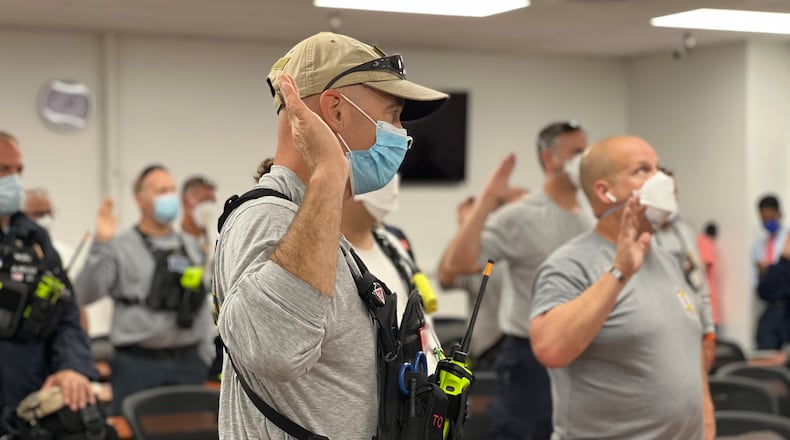Ohio Task Force 1 members take an oath under the Federal Emergency Management Agency. AIMEE HANCOCK/STAFF