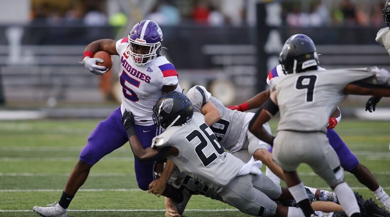Middletown's Lemond Chambers is brought down by Lakota East defenders in the Thunderhawks' 49-7 win on Friday, Sept. 3, 2021. Nick Graham/STAFF
