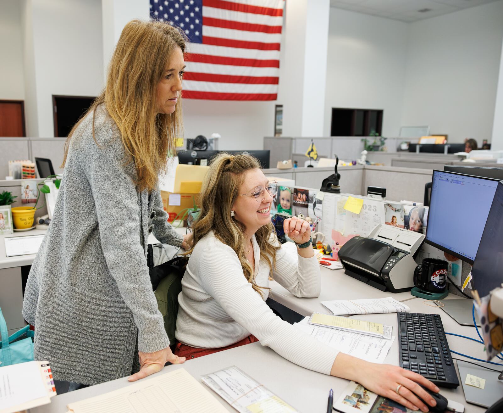 Kettering Clerk of Courts deputy clerks Alissa Gaunt, right, and Donna Myers, left, look over files on a computer in the Clerk of Courts office in the Municipal Court building in Kettering on Thursday. BRYANT BILLING / STAFF