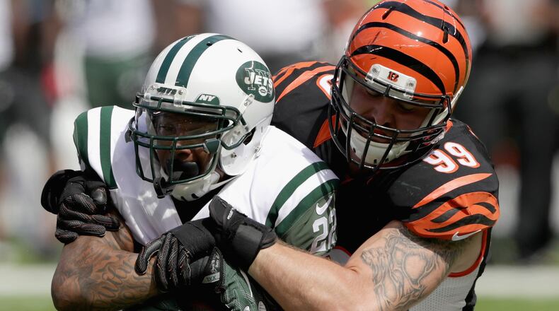 EAST RUTHERFORD, NJ - SEPTEMBER 11: Margus Hunt #99 of the Cincinnati Bengals tackles Matt Forte #22 of the New York Jets during their game at MetLife Stadium on September 11, 2016 in East Rutherford, New Jersey. (Photo by Streeter Lecka/Getty Images)