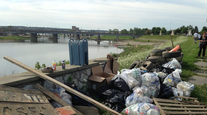 Cox Media Group Ohio employees were among the volunteers who pulled 5,000 pounds of waste from the Great Miami River on Friday, July 18, as part of Clean Sweep 2014. (Staff photo by Amelia Robinson)