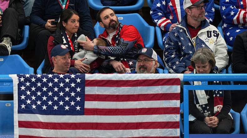 US supporters watch during the gold medal mixed doubles curling match between USA and Sweden, at the 2026 Winter Olympics, in Cortina D'Ampezzo, Italy, Tuesday, Feb. 10, 2026. (AP Photo/Fatima Shbair)