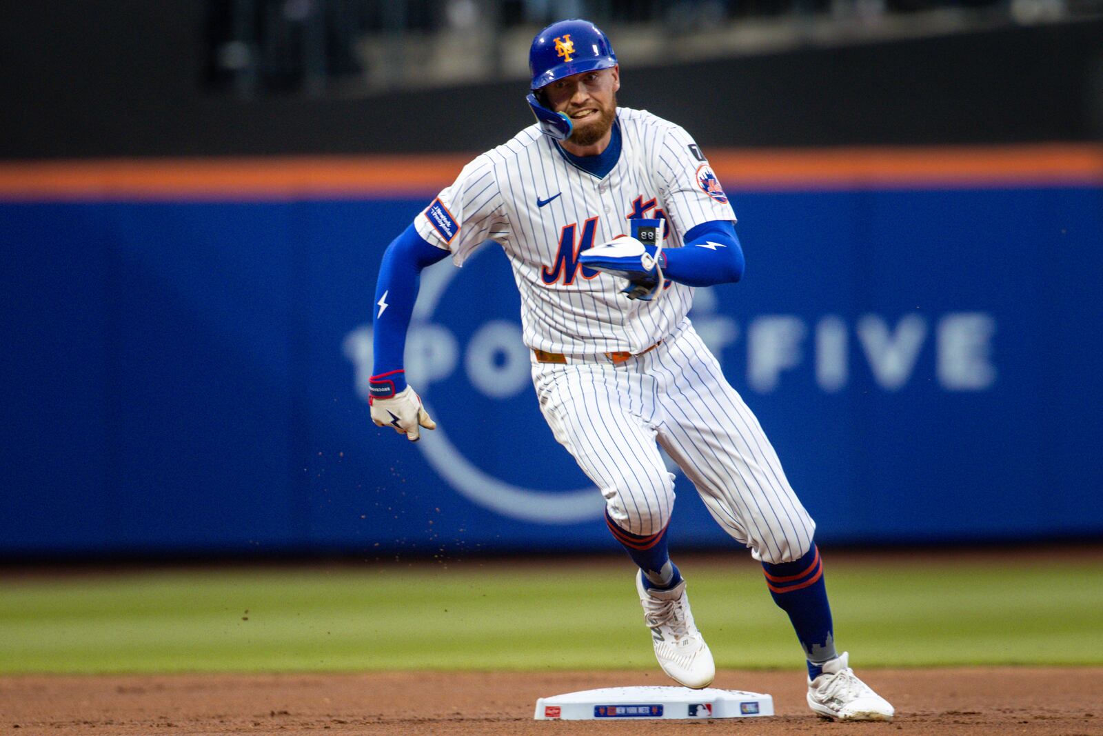 New York Mets' Brandon Nimmo (9) runs back to first base after Juan Soto's hit was caught during the first inning against the Chicago White Sox, Tuesday, May 27, 2025, in New York. (AP Photo/Angelina Katsanis)