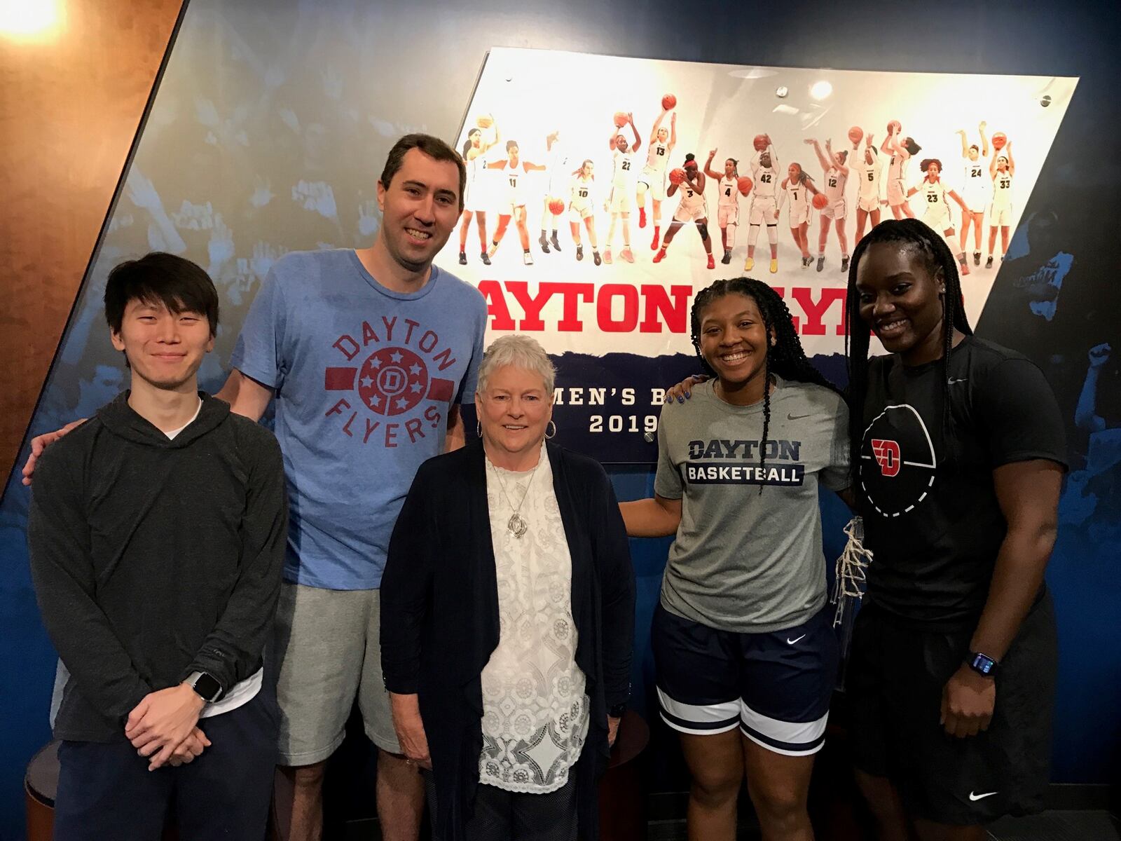 Linda Waltz and part of the UD women’s basketball staff in the Flyers’ offices last week.  (Left to right) Zachary Choo, grad assistant; Ryan Gensler, assistant coach; Linda Waltz, Maya Solomon, director of basketball operations; and Olivia Applegate, former UD player now a Flyers assistant coach. Tom Archdeacon/STAFF