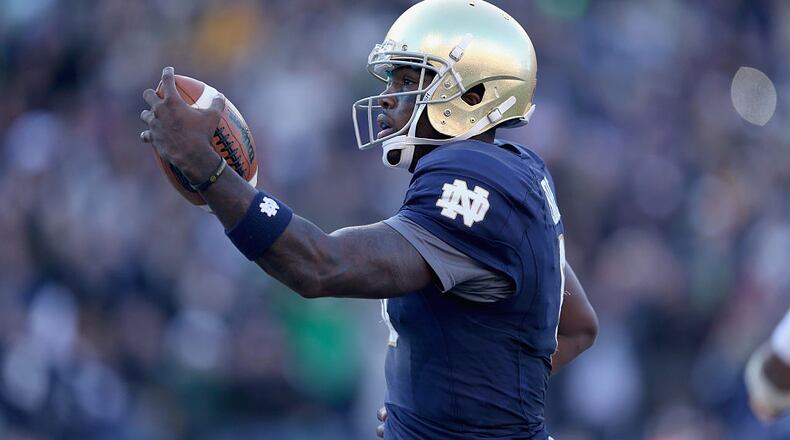 NASHVILLE, TN - DECEMBER 30: Malik Zaire #8 of the Notre Dame Fighting Irish runs for a touchdown against the LSU Tigers during the Franklin American Mortgage Music City Bowl at LP Field on December 30, 2014 in Nashville, Tennessee. (Photo by Andy Lyons/Getty Images)