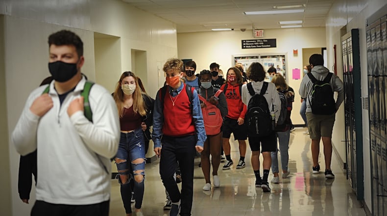 Beavercreek High School students walk to their next classes on Oct. 8, 2020.
