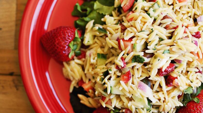 Adam Dillard of Berry Brothers makes his orzo pasta salad with the company’s Strawberry Rosemary Vinaigrette. (Juli Leonard/Raleigh News & Observer/TNS)