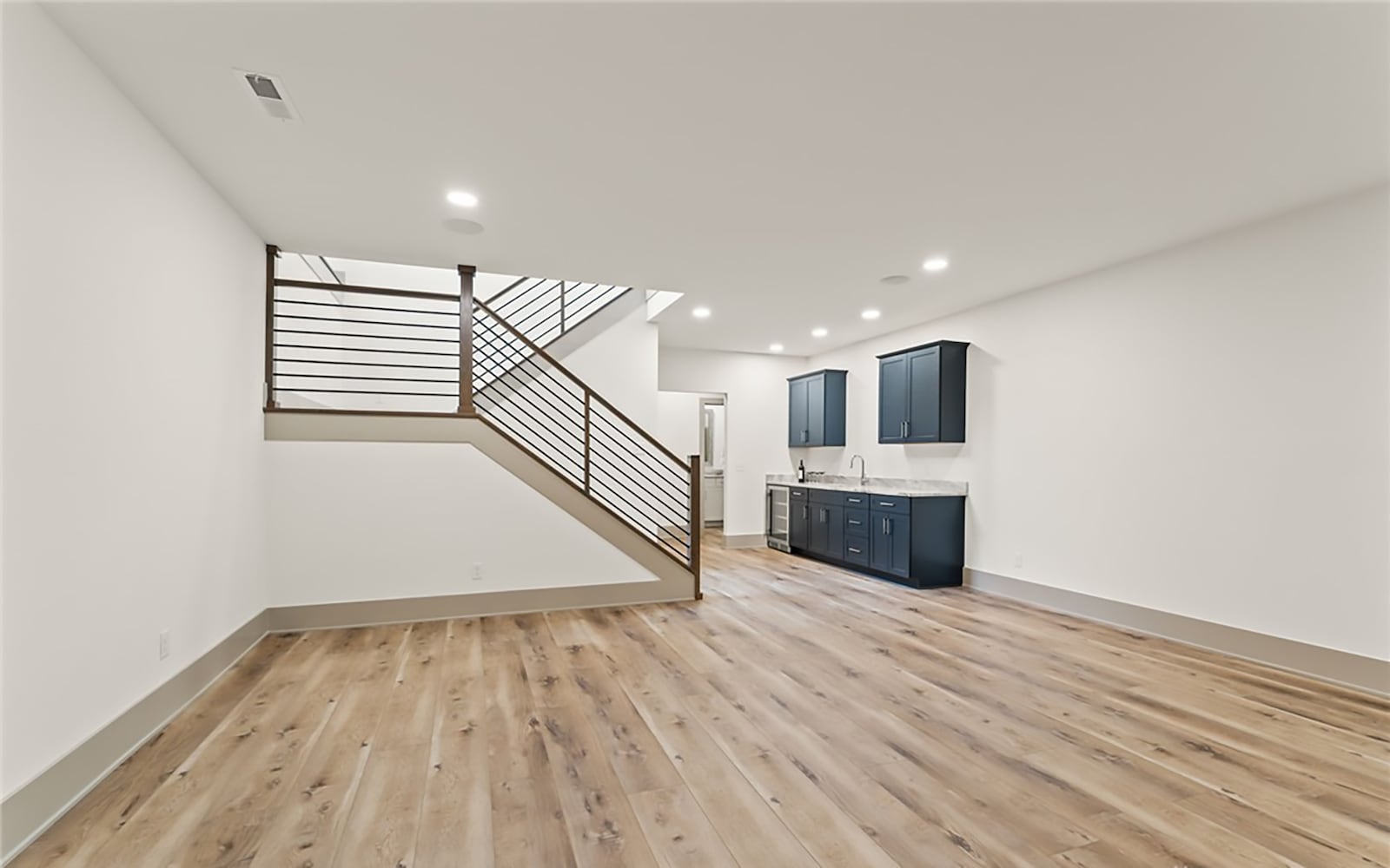 The home has a finished basement with a recreation room with a wet bar, a fourth bedroom (with egress) and full bathroom. CONTRIBUTED