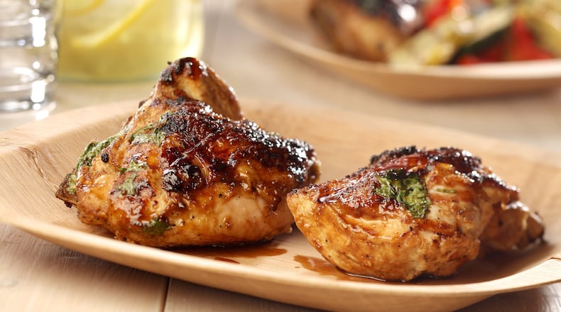 Give chicken a long bath in a coconut, lime, jalapeno and ginger marinade before grilling. (Michael Tercha/Chicago Tribune/TNS)