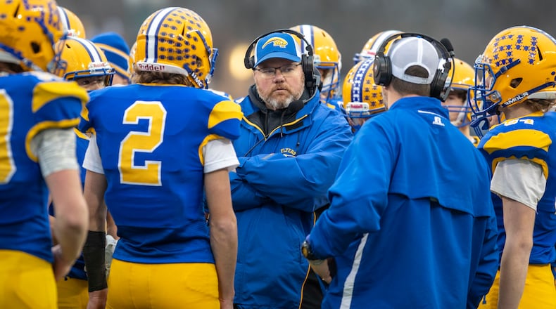 Marion Local coach Tim Goodwin huddles with his team during a 38-0 win over Dalton in the Division VII state championship game in Canton on Dec. 2, 2023. Michael Cooper/CONTRIBUTED