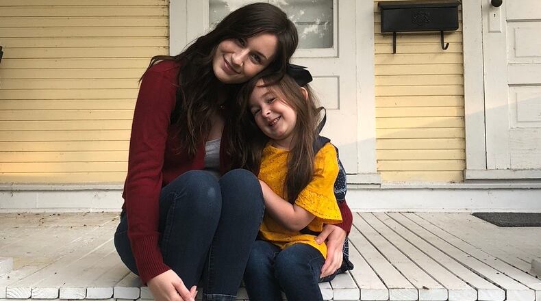 Corey Deel and her daughter, Zoe, pose for their first days of school: Deel went to Sinclair Community College and Zoe attended kindergarten. Courtesy of University of Dayton.