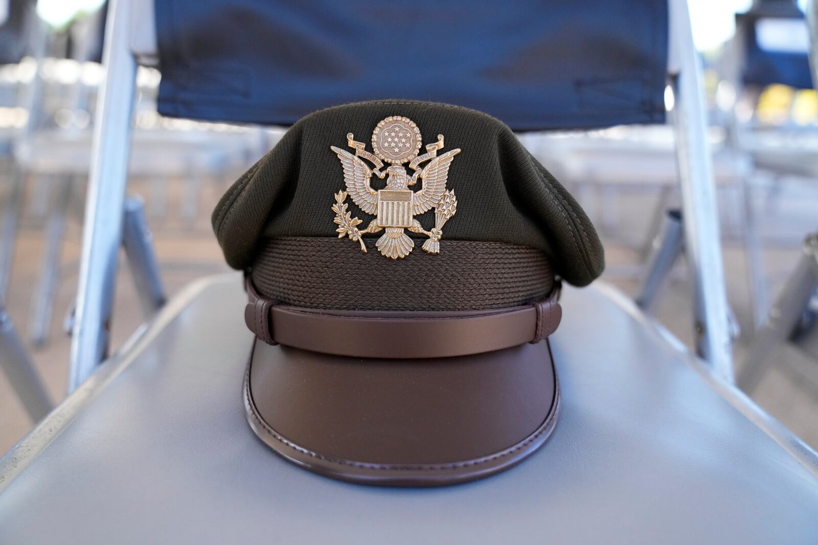 Col. J.D. Evans' hat sits on a chair during a ceremony at Fort Benning, honoring new namesake on Wednesday, April 16, 2025, in Fort Benning, Ga. (AP Photo/Brynn Anderson)