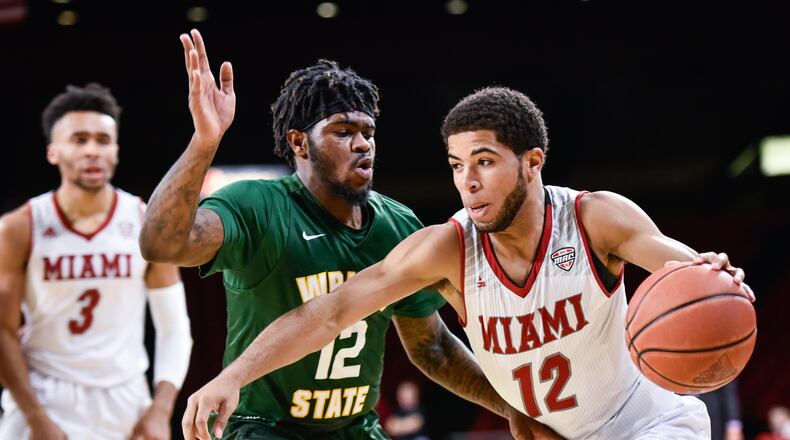 Miami’s Darrian Ringo dribbles toward the hoop around Wright State’s Tye Wilburn during their game Tuesday, Nov. 14, 2017 at Millett Hall on the Miami University Campus in Oxford. NICK GRAHAM/STAFF