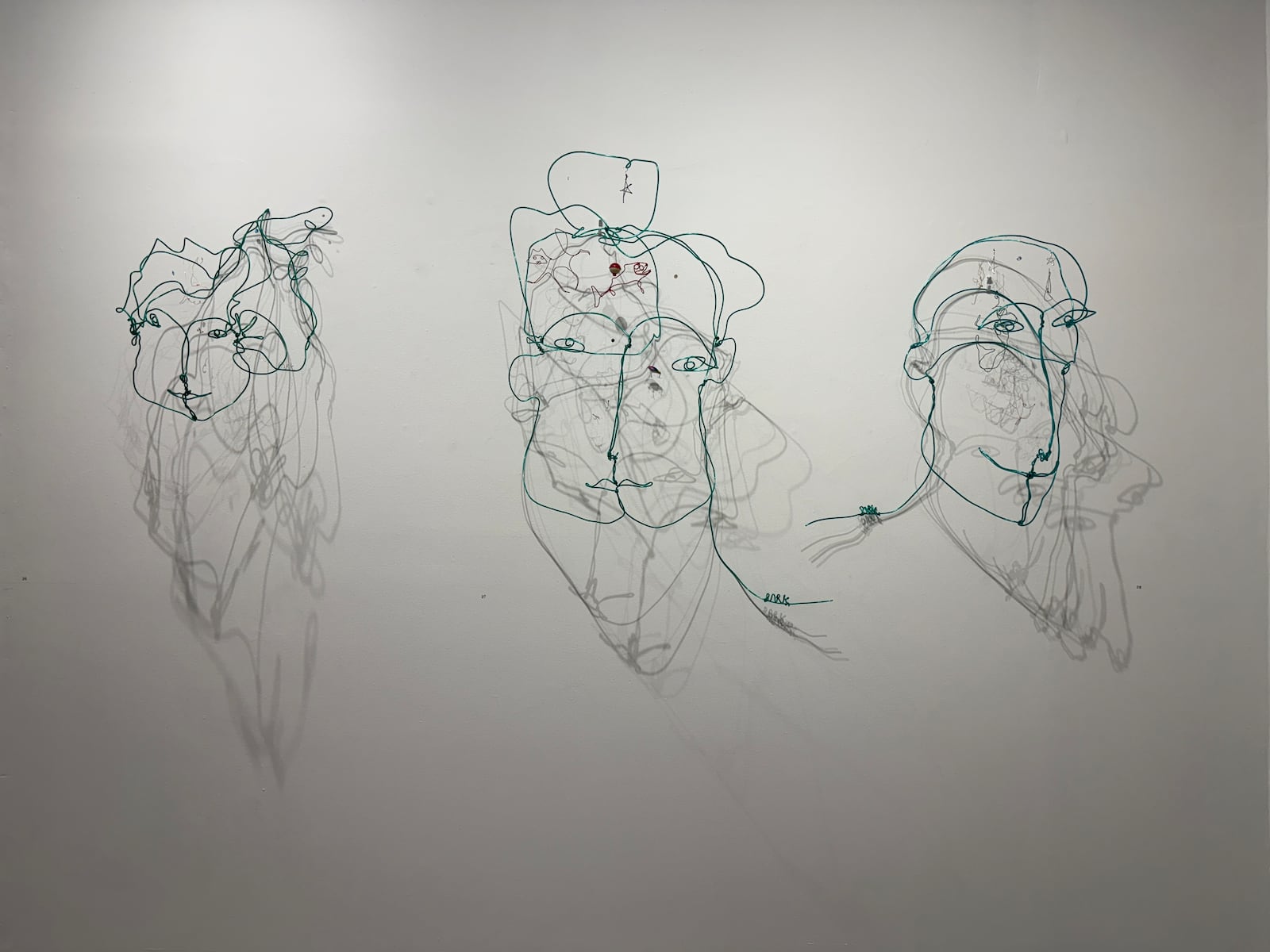 Wire busts by Lori Park at Dana L. Wiley Gallery. The objects inside represent thoughts. HANNAH KASPER/CONTRIBUTED