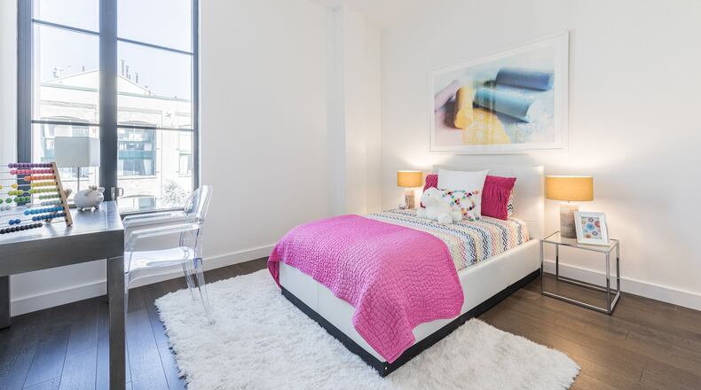 Fun colors including hot pink, yellow and blue help to make this children’s bedroom feel happy and playful. (Design Recipes)