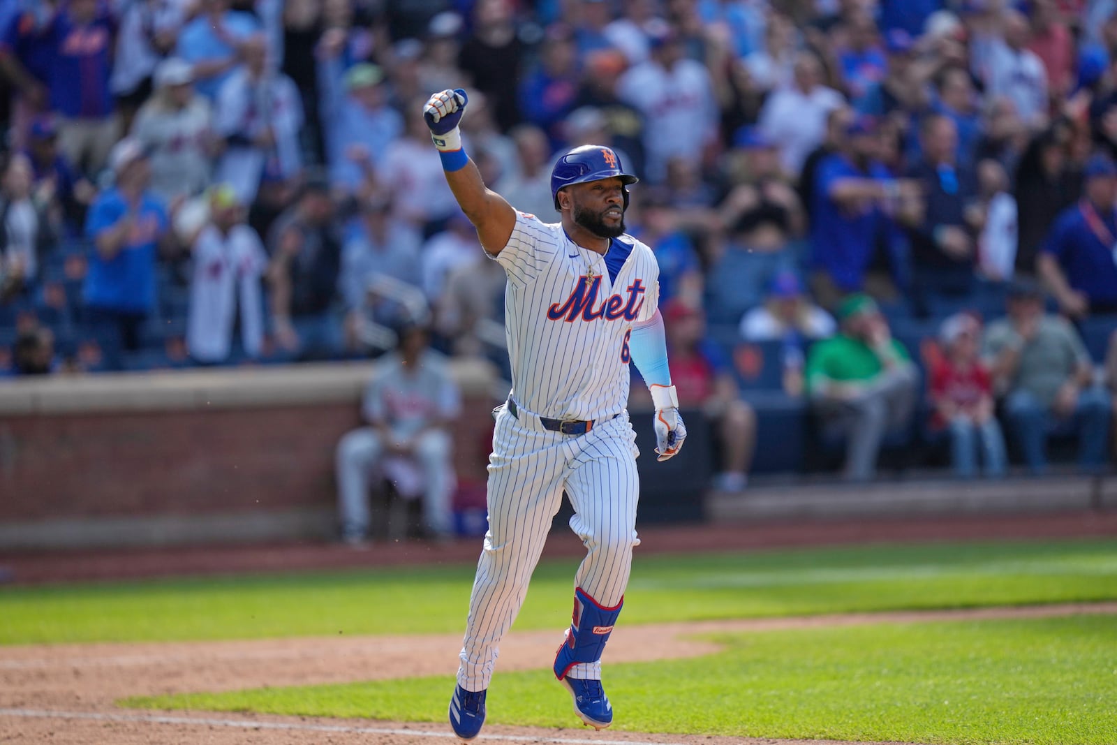 New York Mets' Starling Marte reacts after hitting a walk-off single during the tenth inning of a baseball game against the Philadelphia Phillies, Wednesday, April 23, 2025, in New York. (AP Photo/Seth Wenig)