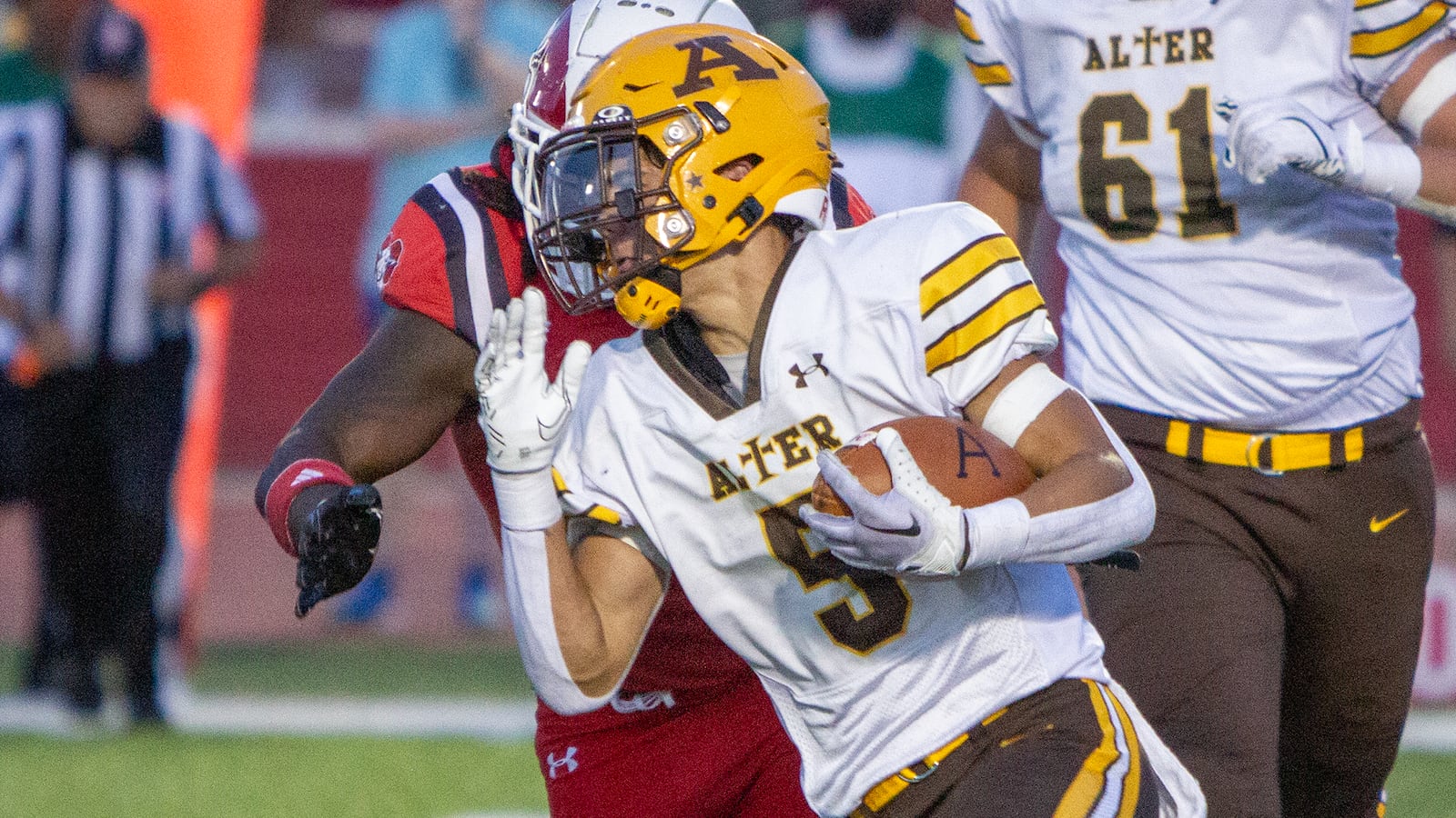 Alter's Drew Cripps runs upfield against Trotwood-Madison during a game earlier this season. Jeff Gilbert/CONTRIBUTED