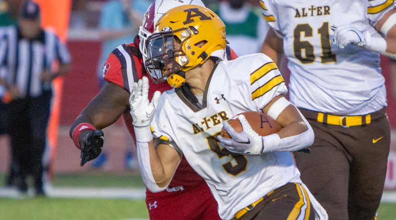 Alter's Drew Cripps runs upfield against Trotwood-Madison during a game earlier this season. Jeff Gilbert/CONTRIBUTED