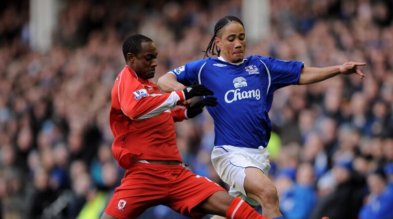 LIVERPOOL, UNITED KINGDOM - MARCH 08: Steven Pienaar of Everton is challenged by Justin Hoyte of Middlesbrough during the FA Cup Sponsored by E.on 6th Round match between Everton and Middlesbrough at Goodison Park on March 8, 2009 in Liverpool, England. (Photo by Shaun Botterill/Getty Images)