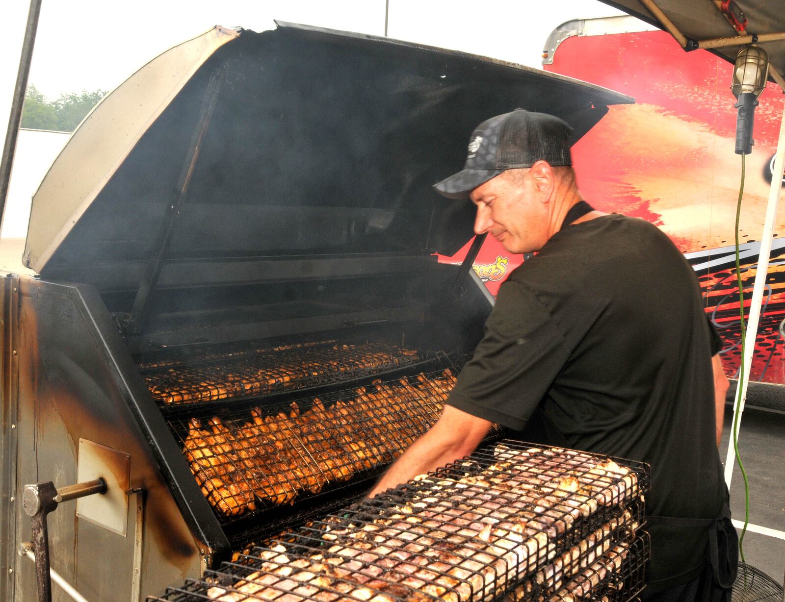 Rain failed to dampen the spirits of visitors to the final day of the 72nd Annual Versailles Poultry Days on Sunday, June 11. Corn Hole, a kiddie tractor pull, a chicken eating contest, an antique car show and live entertainment were just part of Sunday's activities. Funds from the three-day festival support community projects and school activities. DAVID A. MOODIE/CONTRIBUTING PHOTOGRAPHER