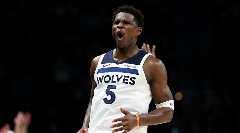 Minnesota Timberwolves guard Anthony Edwards (5) celebrates his three-point basket during the second half of an NBA basketball game against the Cleveland Cavaliers, Thursday, Jan. 8, 2026, in Minneapolis. (AP Photo/Matt Krohn)