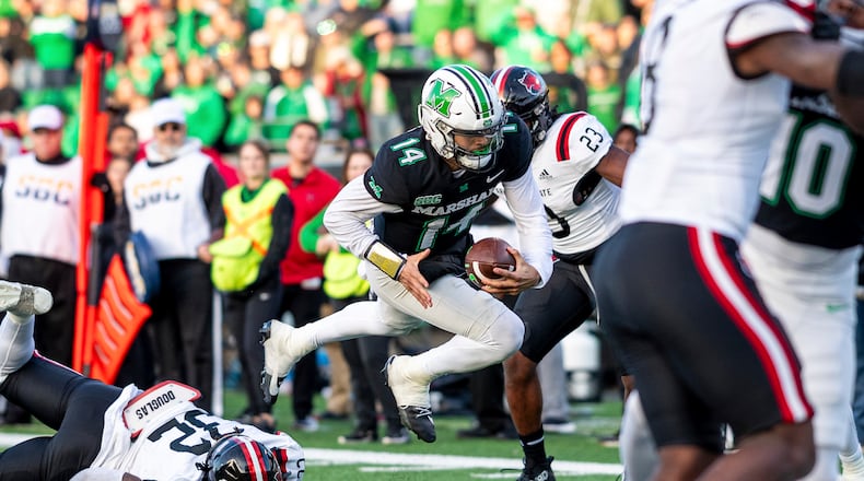 Marshall quarterback Cam Fancher (14) dives in for a rushing touchdown against Arkansas State during an NCAA college football game Saturday, Nov. 25, 2023, in Huntington, W.Va. (Sholten Singer/The Herald-Dispatch via AP)
