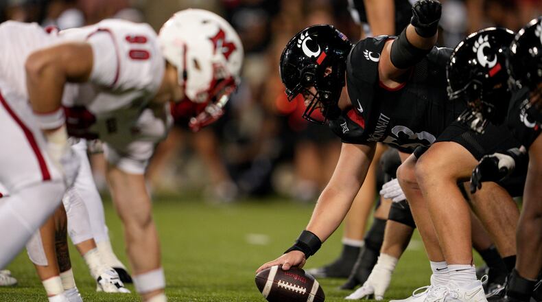 Cincinnati offensive lineman Gavin Gerhardt (53) looks to hike the ball during the first half of an NCAA college football game against Miami (Ohio), Saturday, Sept. 16, 2023, in Cincinnati. (AP Photo/Jeff Dean)