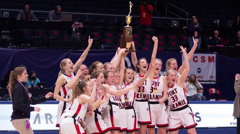 Fort Loramie's girls basketball team celebrates a Division IV state championship Saturday at UD Arena. Jeff Gilbert/CONTRIBUTED