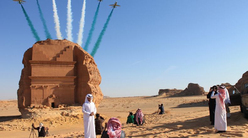 Saudi visitors watch an aerial flying display over Mada'in Saleh, a UNESCO World Heritage Site, in Mada'in Saleh, Saudi Arabia, onan. 31, 2017. Bloomberg photo by Vivian Nereim.