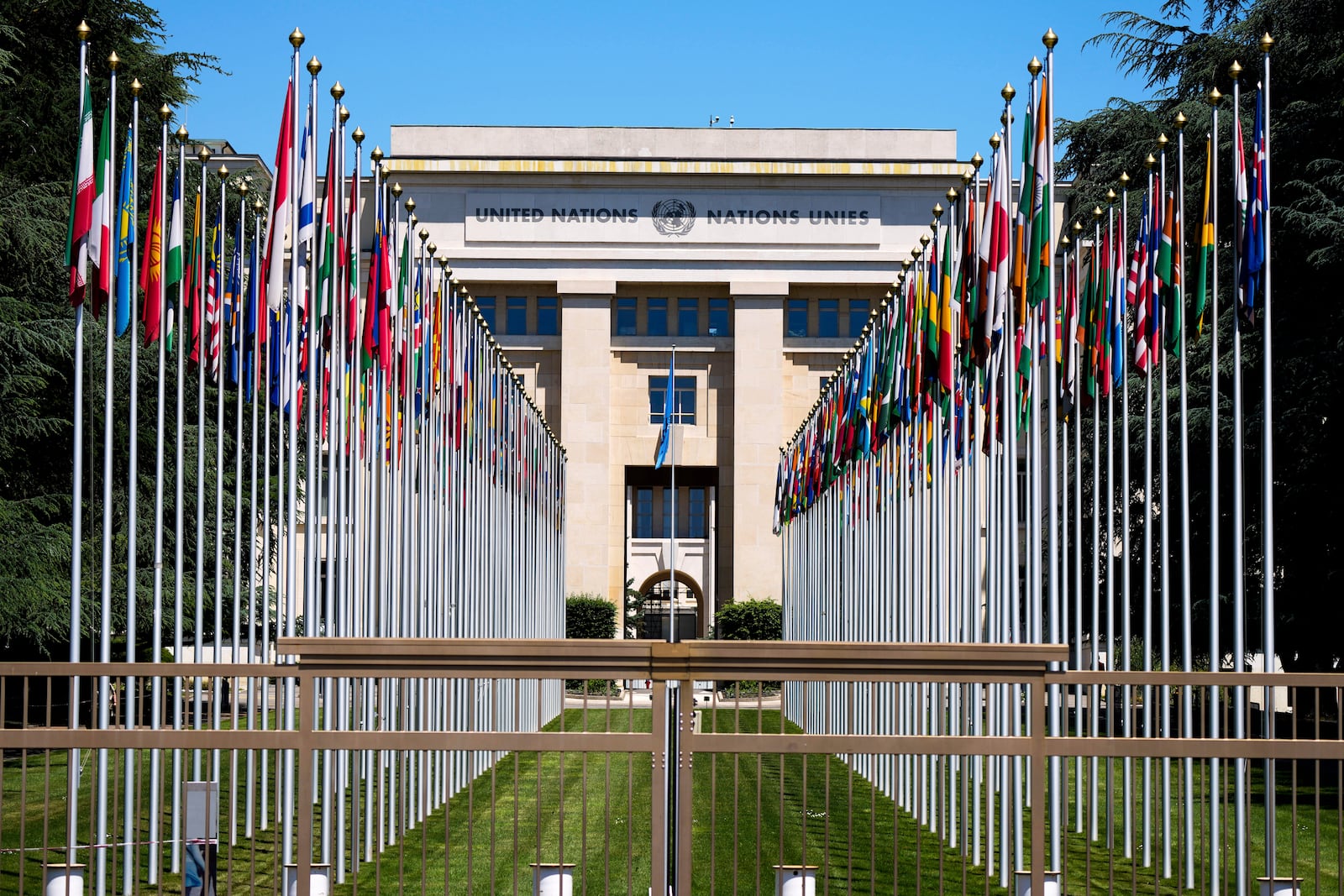 FILE - Flagpoles line in rows in front of a building of the United Nations in Geneva, Switzerland, June 14, 2021. (AP Photo/Markus Schreiber, File)