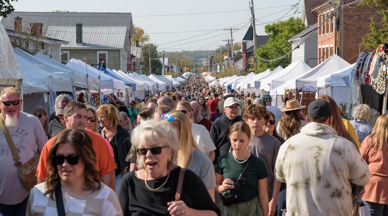 The 54th annual Ohio Sauerkraut Festival happened in downtown Waynesville on Saturday, Oct. 12 and Sunday, Oct. 13, 2024. The festival combines 60 sauerkraut-related food items with 460 craft vendors from 25 states and attracts over 350,000 people annually. Here’s a look at Sunday’s fun. TOM GILLIAM/CONTRIBUTING PHOTOGRAPHER