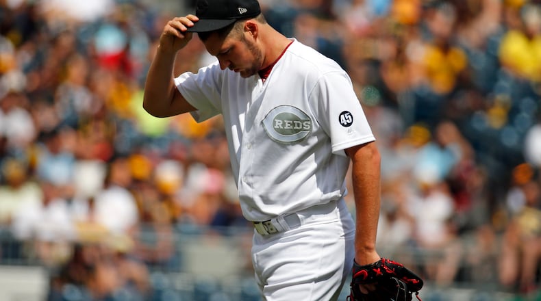 PITTSBURGH, PA - AUGUST 25:  Trevor Bauer #27 of the Cincinnati Reds reacts in the second inning against the Pittsburgh Pirates at PNC Park on August 25, 2019 in Pittsburgh, Pennsylvania. Teams are wearing special color schemed uniforms with players choosing nicknames to display for Players' Weekend. (Photo by Justin K. Aller/Getty Images)