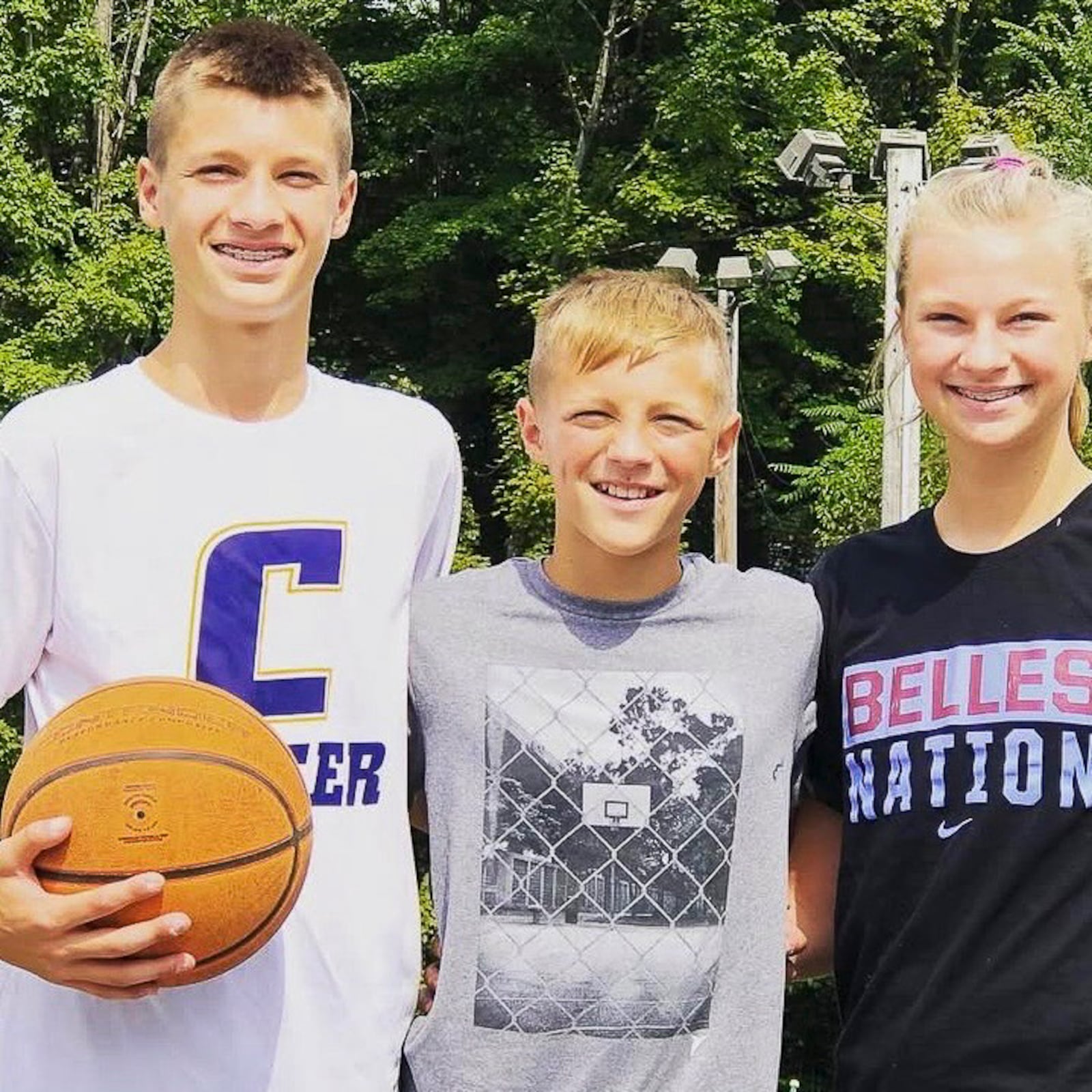Jordan Derkack with his younger brother Aiden who is now a 6-foot-7 4 star recruit and his sister Taylor who is a 6-foot guard playing for UMass. CONTRIBUTED PHOTO