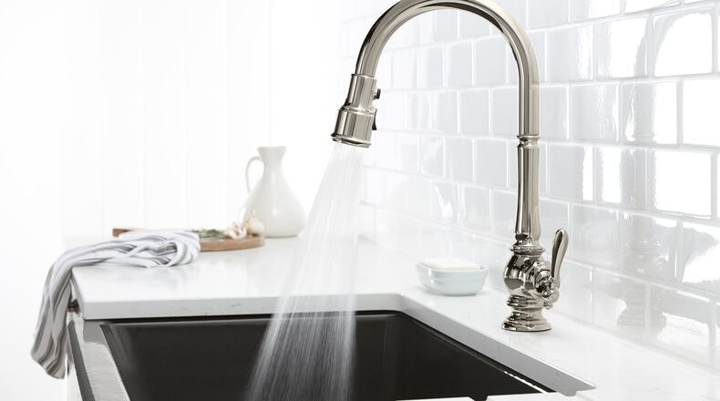 A pull-out faucet has the edge when filling things like dog dishes and coffee makers outside of the sink bowl. (Kohler)