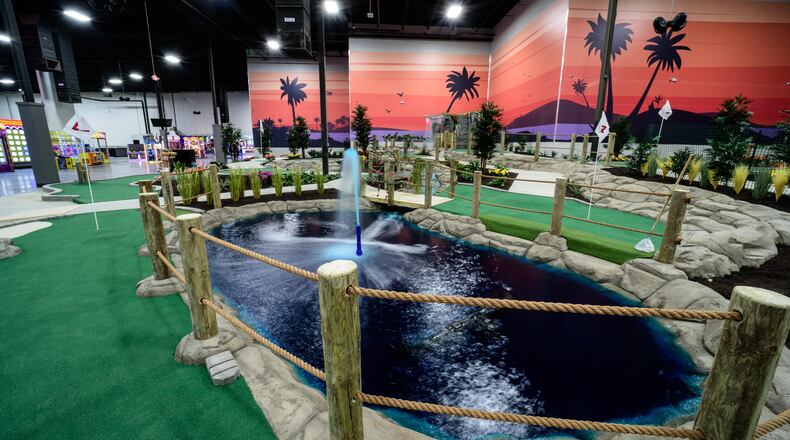 Here’s a sneak peek of Scene75 Entertainment Center's new Sunset Island mini-golf course. The indoor entertainment center is reopening today, December 16, 2020 after being closed for extensive renovations and repairs due to heavy damage from the 2019 Memorial Day tornadoes. TOM GILLIAM / CONTRIBUTING PHOTOGRAPHER