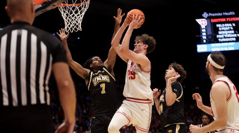 Dayton's Amaël L'Etang looks for a shot against Maryland, Baltimore County on Saturday, Nov. 8, 2025, at UD Arena. David Jablonski/Staff