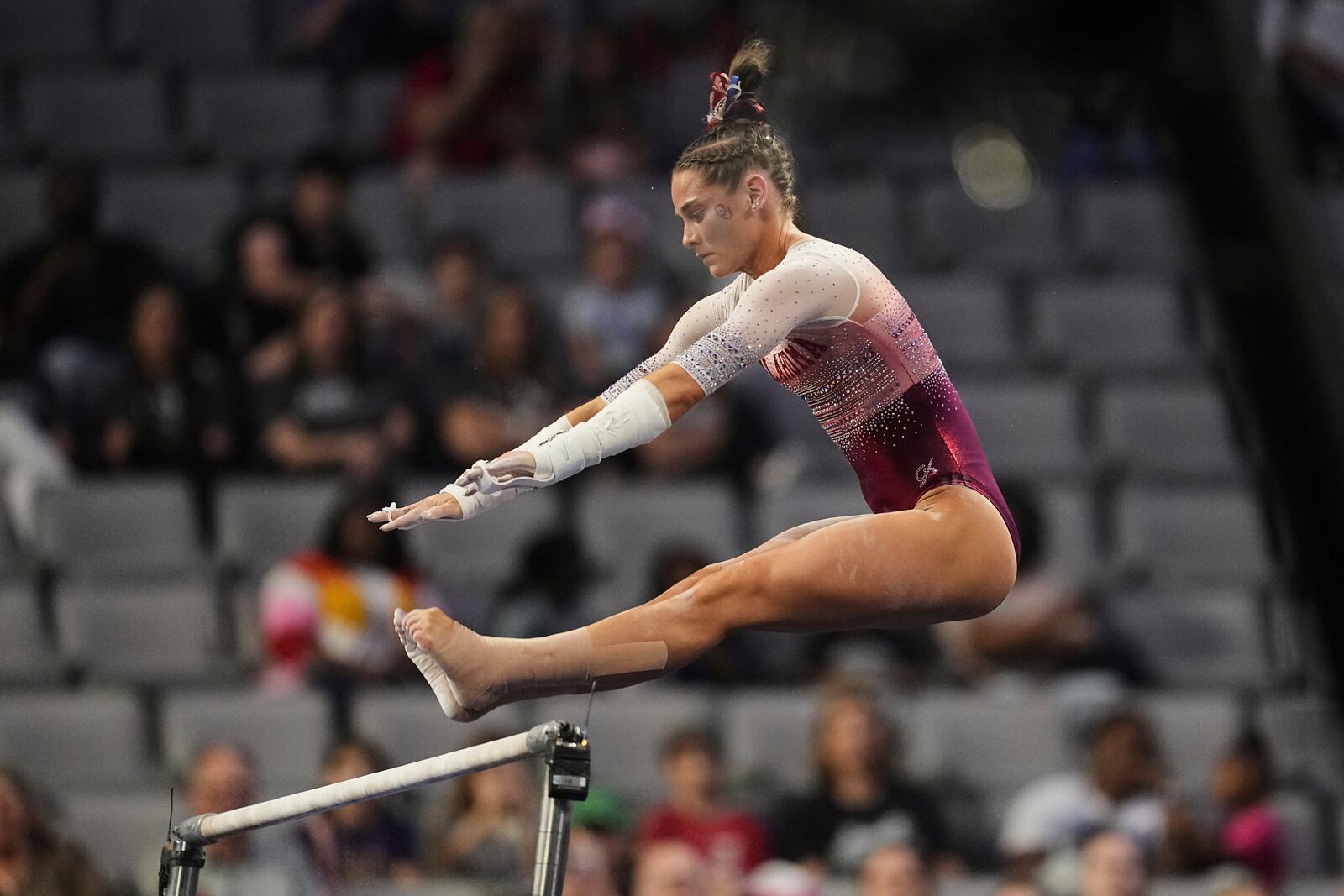 Oklahoma's Jordan Bowers competes on the uneven bars during the NCAA women's gymnastics championships in Fort Worth, Texas, Thursday, April 17, 2025. (AP Photo/Tony Gutierrez)
