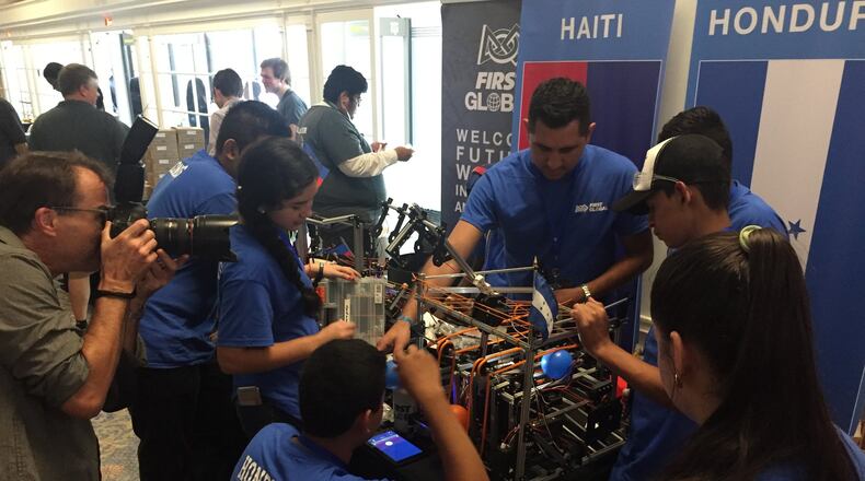 The Honduran robotics team makes repairs to the climbing arm of their robot before one of their matches at the FIRST Global Robotics Competition in Washington, D.C. CONTRIBUTED
