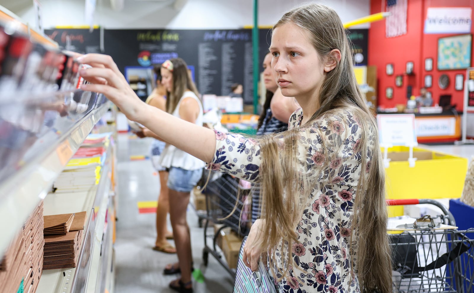 Eva Foote looks at school supply items while shopping at Crayons to Classrooms on Wednesday, July 30. Foote is entering her first year at Springboro Intermediate School. BRYANT BILLING / STAFF