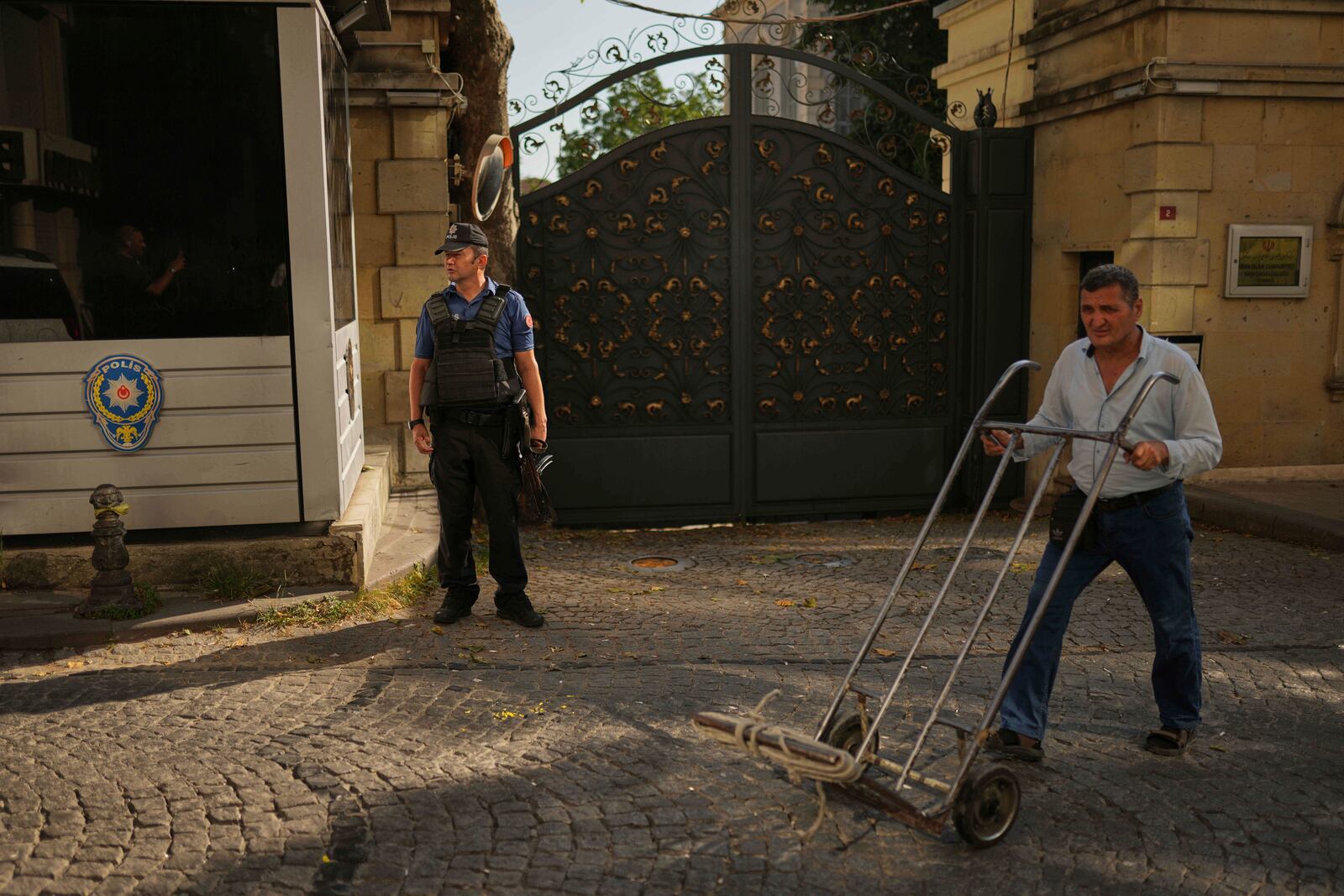 A policeman stands guard outside of the Iranian consulate as European and Iranian diplomats meet for talks over Tehran's nuclear program, in Istanbul, Turkey, Friday, July 25, 2025. (AP Photo/Francisco Seco)