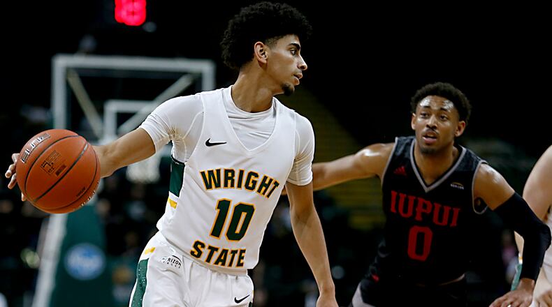 Wright State University guard Trey Calvin is covered by IUPUI guard Jaylen Minnett during their Horizon League game at the Nutter Center in Fairborn Sunday, Feb. 16, 2020. Wright State won 106-66. Contributed photo by E.L. Hubbard