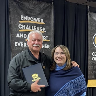 Centerville School District Board of Education member Dr. David Roer is presented with proclamations from the Montgomery County Board of County Commissioners by Commissioner Carolyn Rice at the school board's meeting Monday, Dec. 15, 2025. Roer, who has 32 years of experience on the school board, opted to not run for re-election last month. CONTRIBUTED