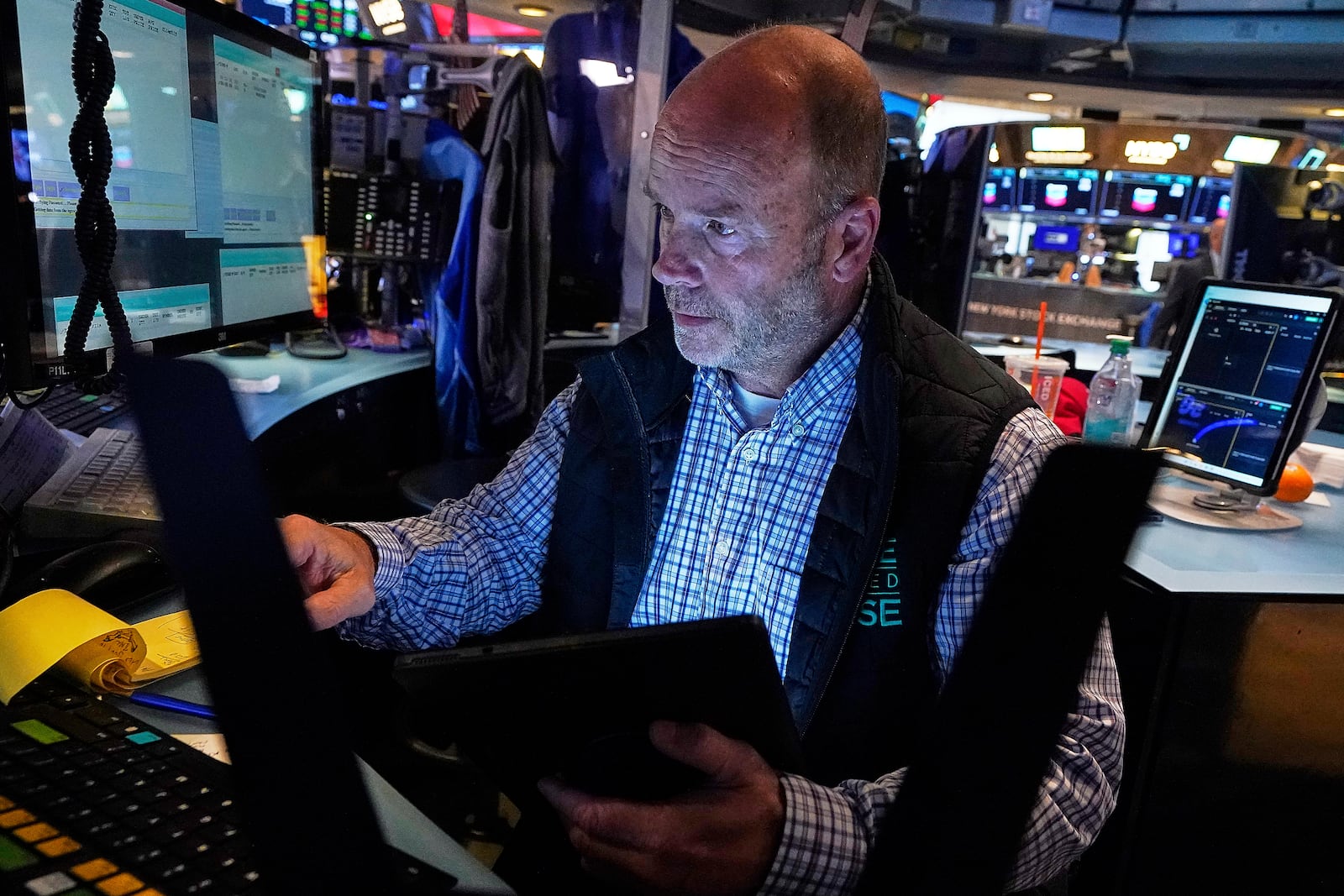 Trader Peter Mancuso works on the floor of the New York Stock Exchange, Friday, July 18, 2025. (AP Photo/Richard Drew)