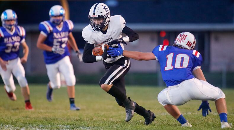 Greenon High School senior wide receiver Clay Hough runs past Greeneview's Caleb Allen during their game on Friday night at Don Nock Field in Jamestown. The Knights won 21-20 to win their second straight Ohio Heritage Confernece South Division championship. CONTRIBUTED PHOTO BY MICHAEL COOPER